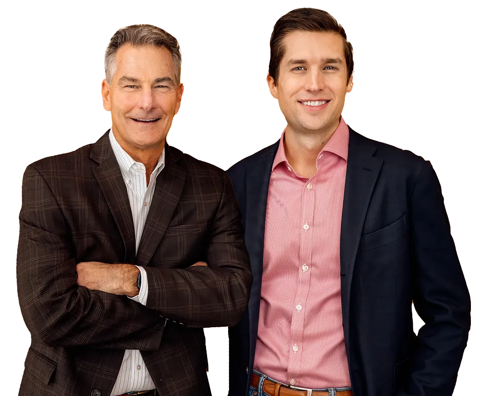 Two professionally dressed men smiling, one in a brown plaid blazer and the other in a navy suit jacket.